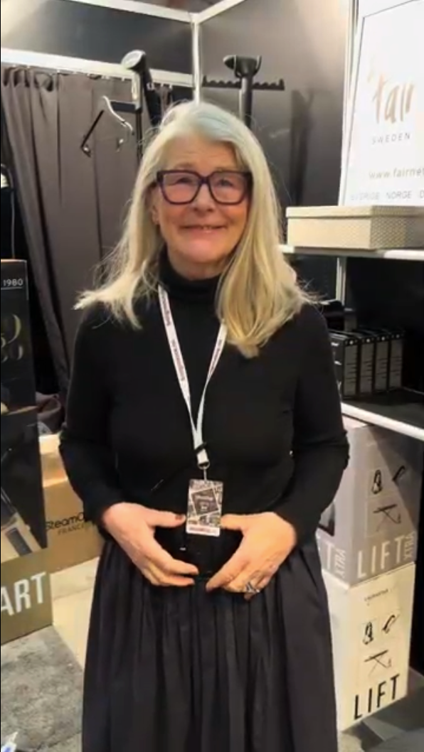 Smiling woman at an exhibition stand