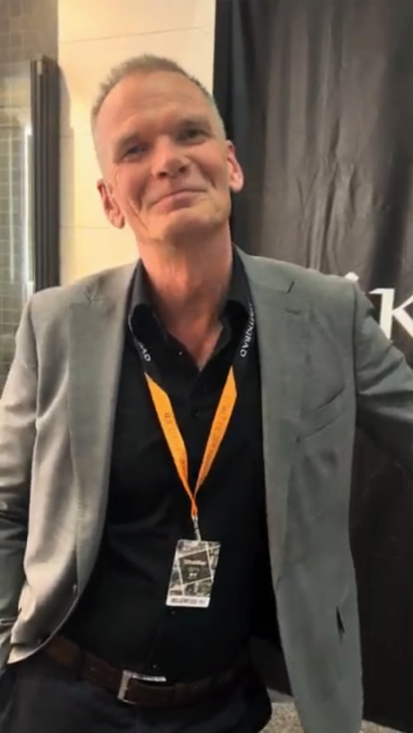 Smiling woman at an exhibition stand